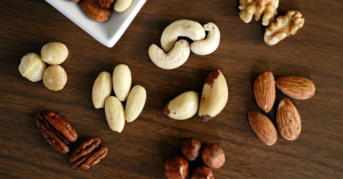 Close Up Of Various Nuts On A Wooden Table Showcasing Healthy Snacking Options
