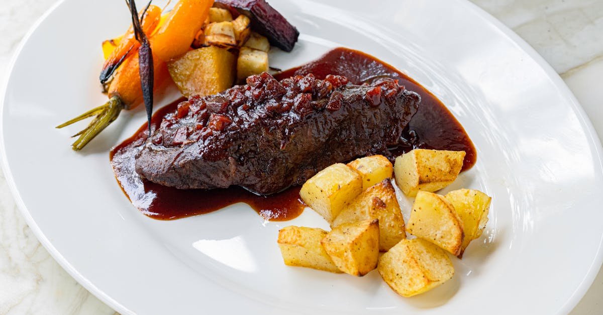 Gourmet Beef In Rich Sauce With Roasted Vegetables And Potatoes